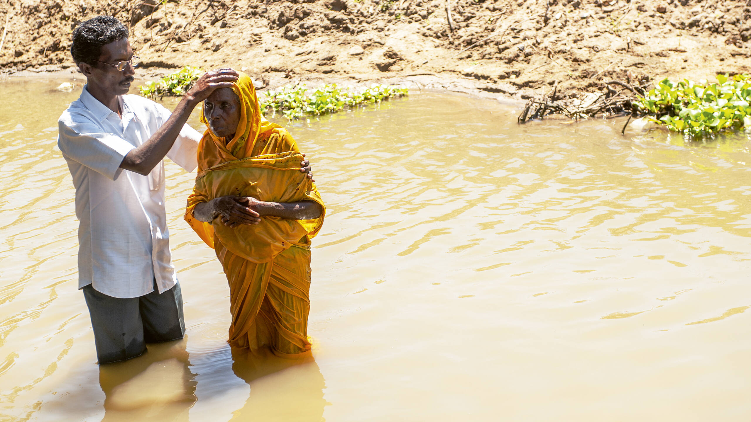a_man_and_a_woman_in_river_getting_baptised_photo_by_IMB_edit